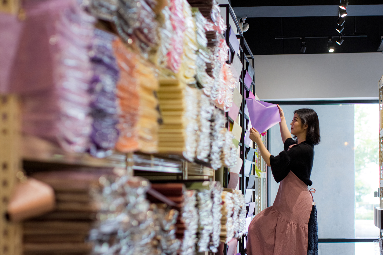 Professional Female Owner Checking Inventory