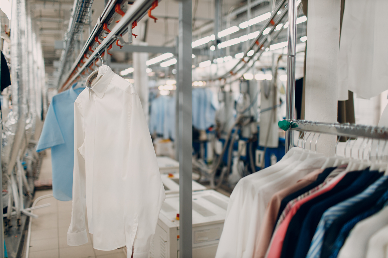 Dry Cleaning Clothes. Clean Cloth Chemical Process. Laundry Industrial Dry Cleaning