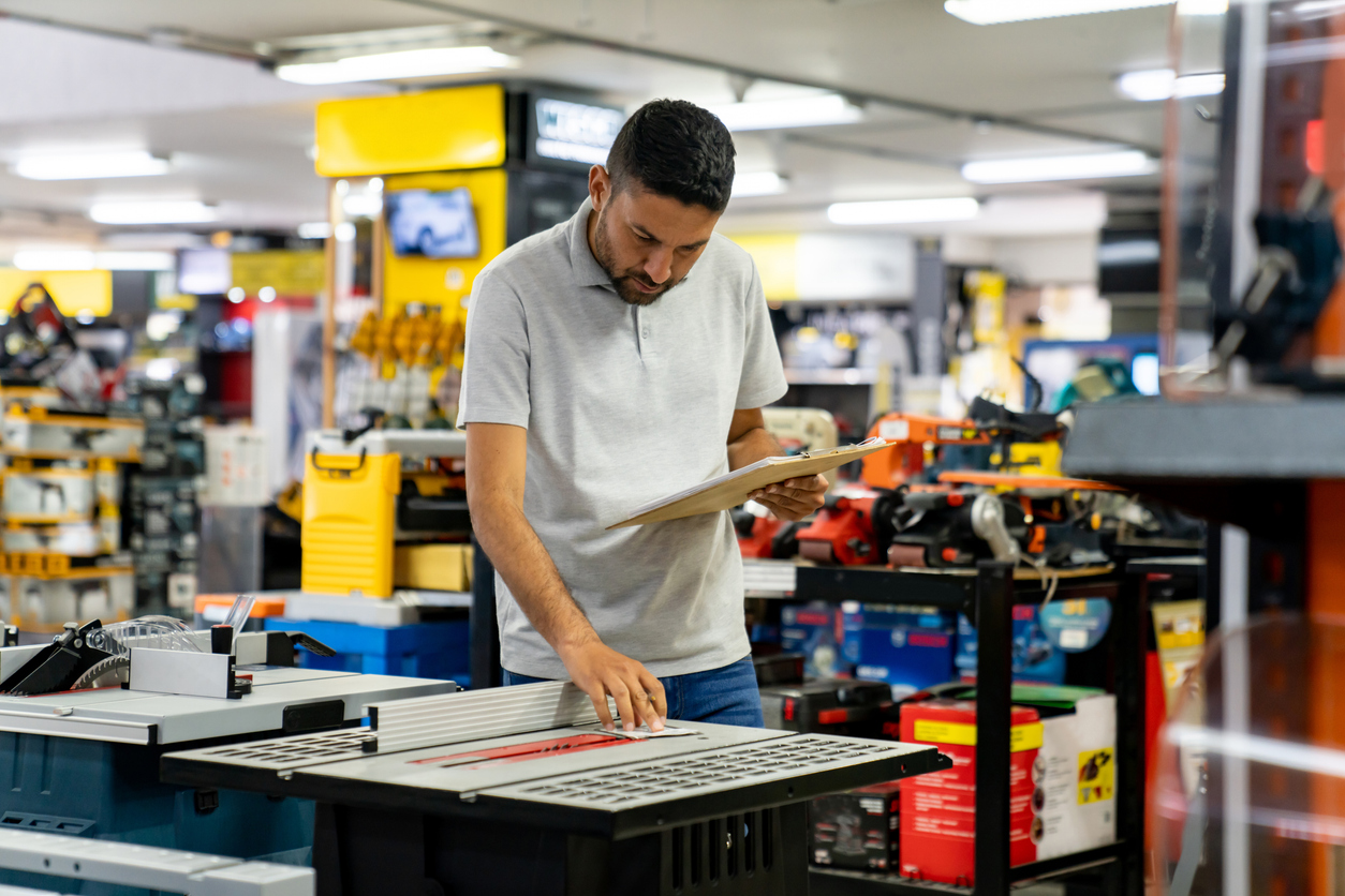 Man Working At A Hardware Store And Doing An Inventory